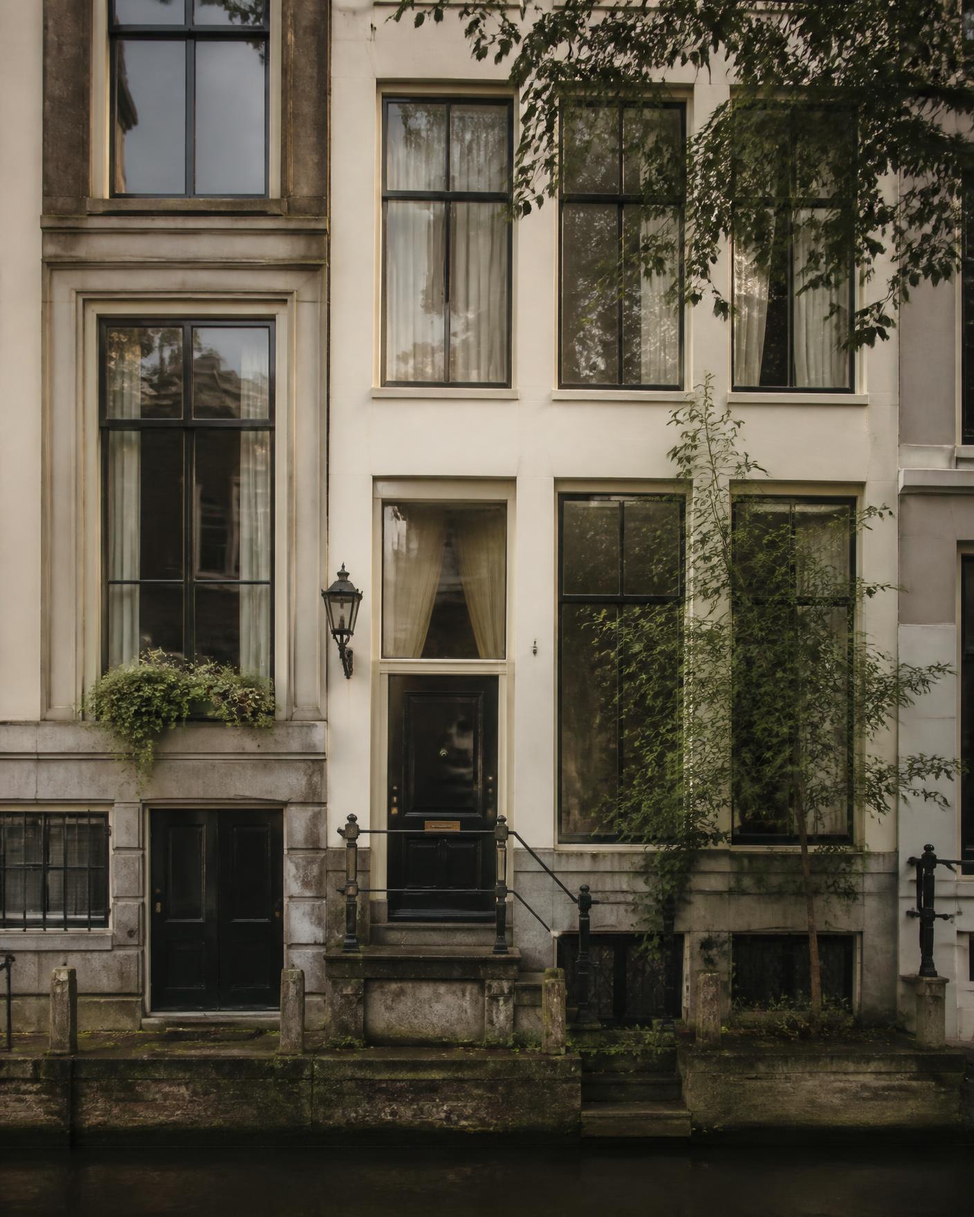 Amsterdam canal-side facade in morning light